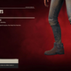 The gear menu in Far Cry 6 showing some dusty black jeans and dark red boots against a blood red background.